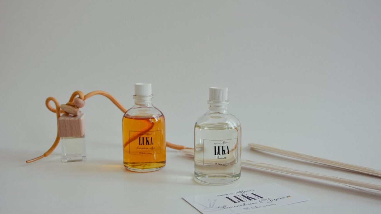 Minimalist composition of perfumed bottles and reed diffusers for aromatherapy.